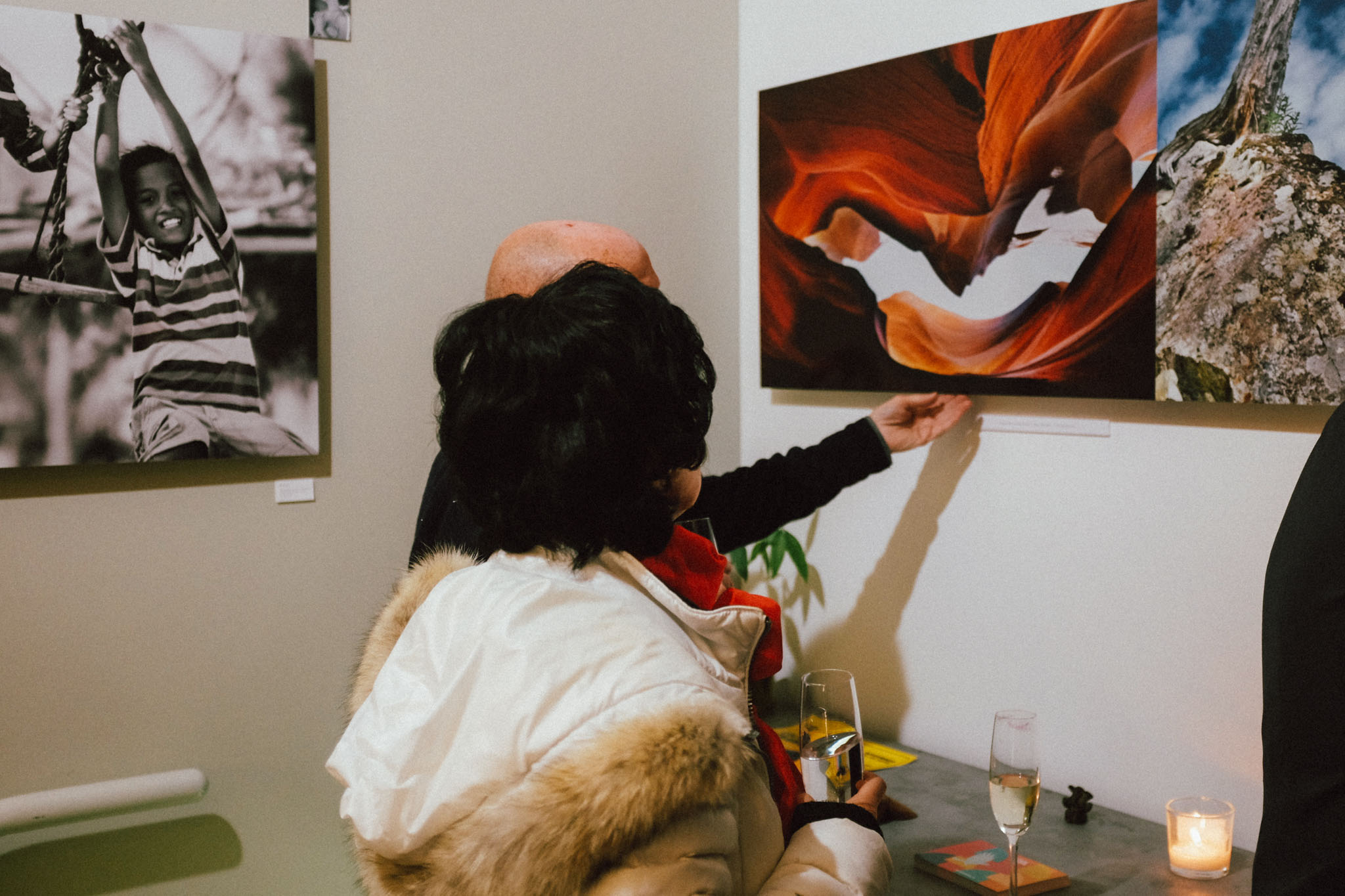 Garrett Andrew Chong Photographic Collage "Ascension" being reviewed by John Steil and Art Collector Eileen M. at 2018 Culture Crawl Downtown Vancouver BC